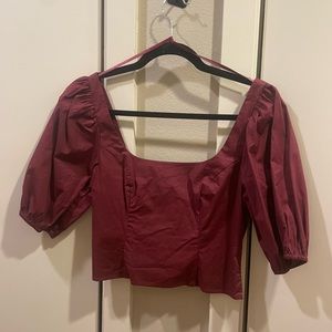 Designer STAUD maroon, short sleeve top. Never worn! Size 0. It’s too big for me